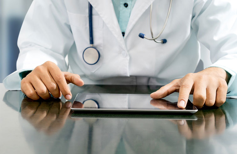 Doctors using a tablet
