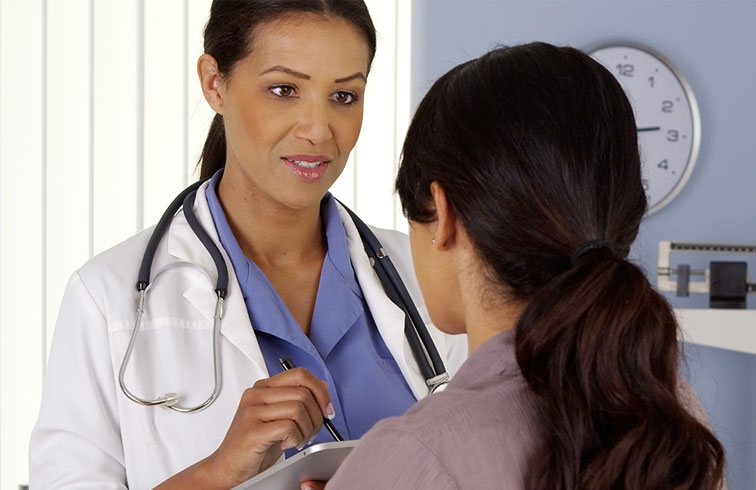 Doctor talking with patient